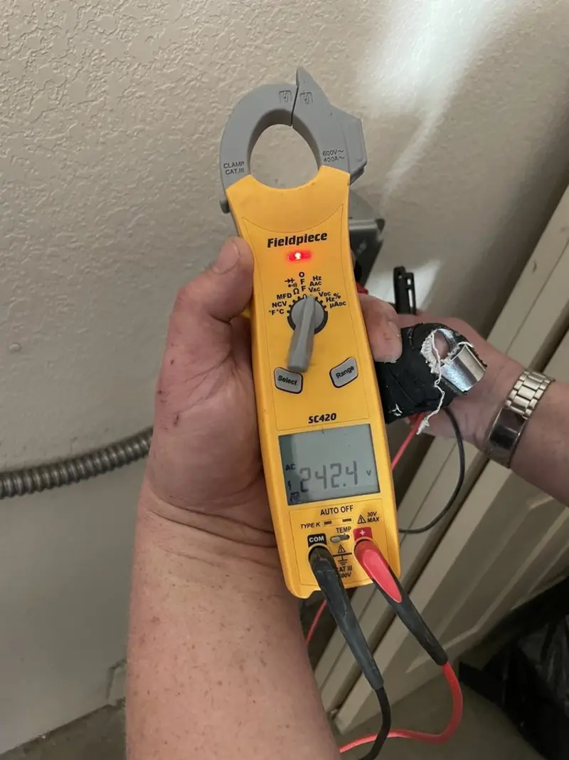Voltage testing with clamp meter during Recessed Lighting Installation in Commerce
